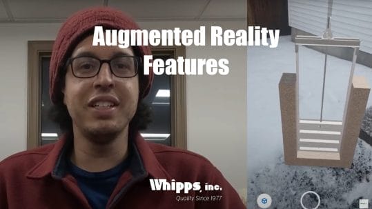 Project Engineer, Derek Lewis, presenting Whipps, Inc.’s augmented reality (AR) feature, with a 3D model of a water control gate projected onto an outdoor snowy surface using AR technology.